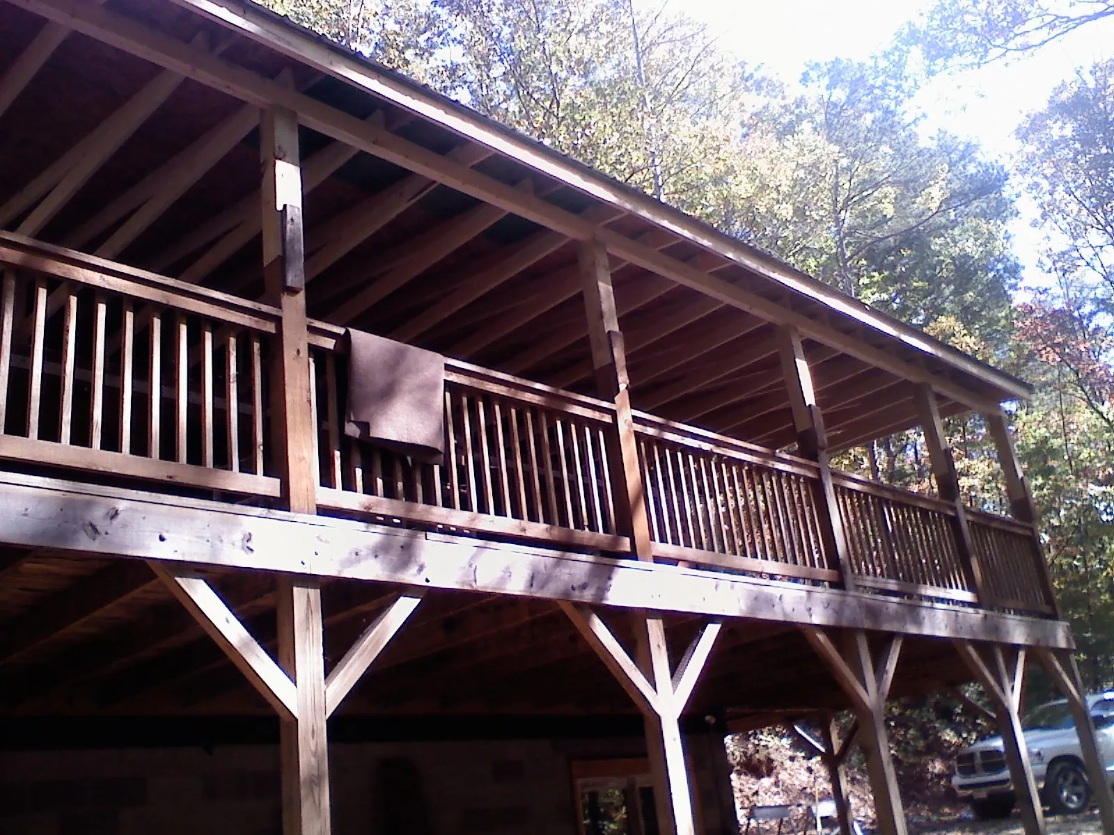 Timber framing under a new elevated porch and deck — Roof Leak Repair in Pella by Roofing Brothers